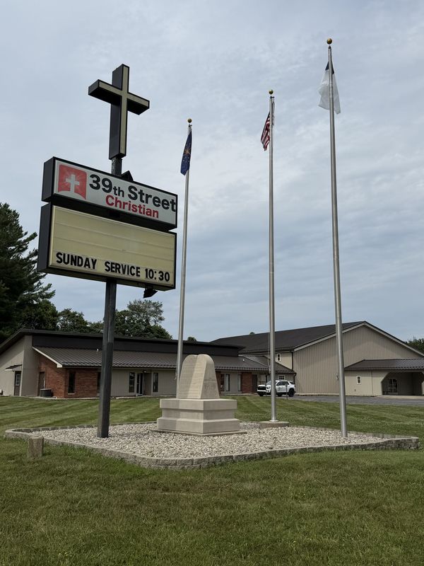 A monument inscribed with the Ten Commandments and the Bill of Rights sits in front of 39th Street Christian Church in Bedford, Indiana. State leaders are seeking to overturn a two-decades-old court ruling to return it to the Statehouse.
