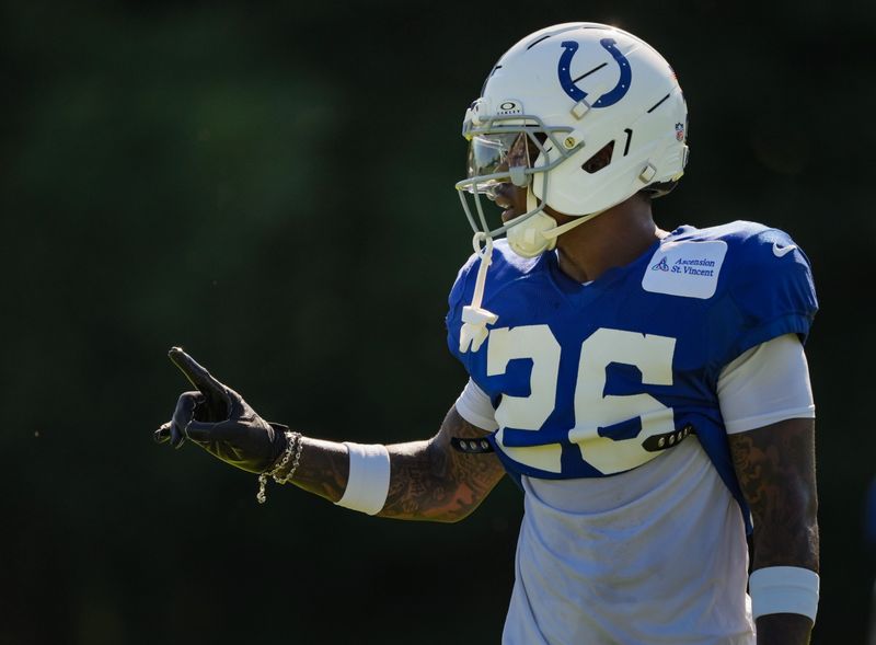 Indianapolis Colts cornerback Cam Taylor-Britt (26) talks with teammates on Tuesday, Aug. 4, 2026, during practice at Colts Camp at Grand Park in Westfield.