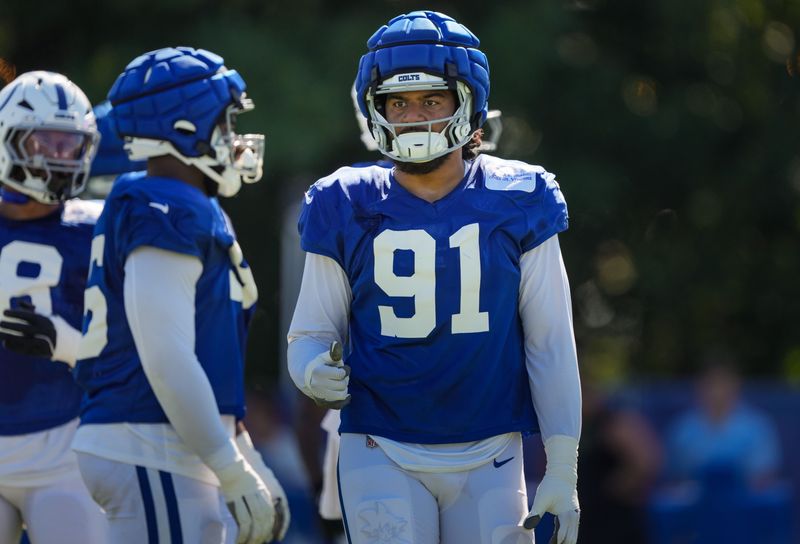 Indianapolis Colts defensive end Jaylahn Tuimoloau (91) gives a thumbs-up to a teammate on Tuesday, Aug. 4, 2026, during practice at Colts Camp at Grand Park in Westfield.