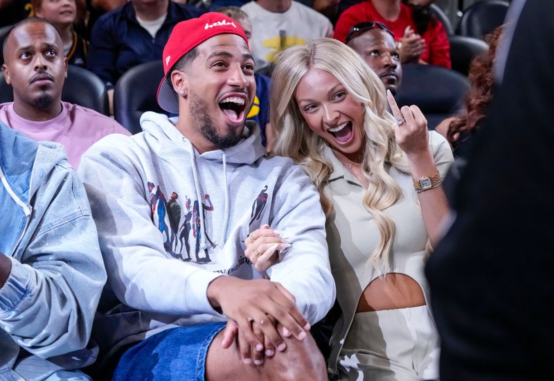 Tyrese and Jade Haliburton pose for a photo on Thursday, Aug. 6, 2026, during the game at Gainbridge Fieldhouse in Indianapolis. The Las Vegas Aces defeated the Indiana Fever in overtime, 86-84.