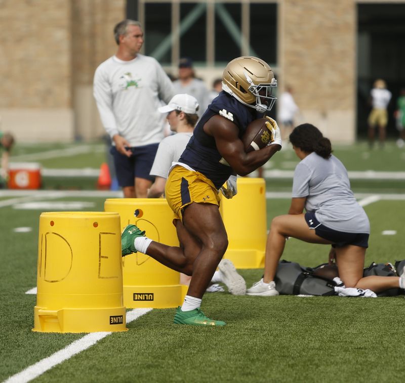 Notre Dame football junior Kedren Young runs in between yellow cans during a practice Friday, Aug. 7, 2026, at the Irish Athletics Center in South Bend.