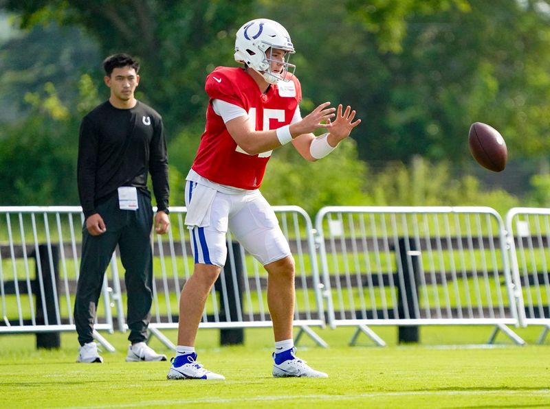 Indianapolis Colts quarterback Riley Leonard (15) is passed the ball during Colts Camp Salute to Service day at Grand Park on Saturday, Aug. 8, 2026, in Westfield, Ind.