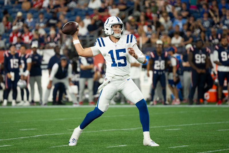 Indianapolis Colts quarterback Riley Leonard (15) throws during a preseason game against the New England Patriots at Gillette Stadium.