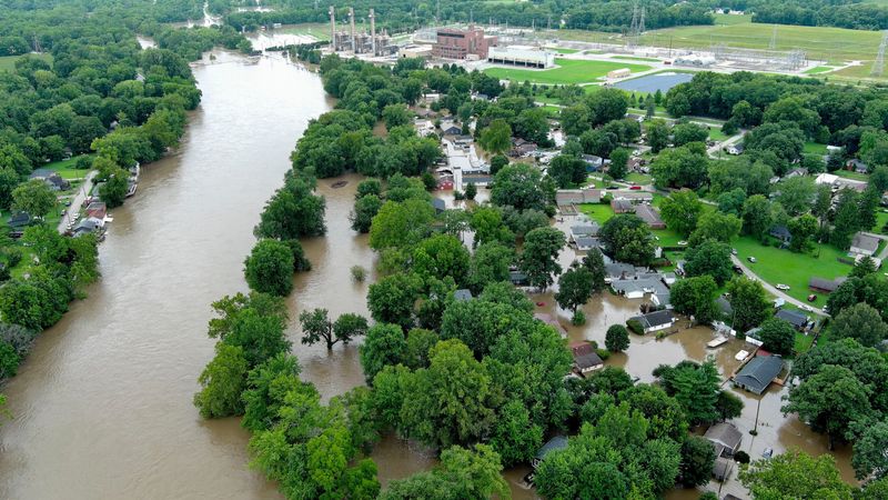 Floodwaters from the White River spill the banks into the Riverwood neighborhood Friday, Aug. 14, 2026, in Noblesville.