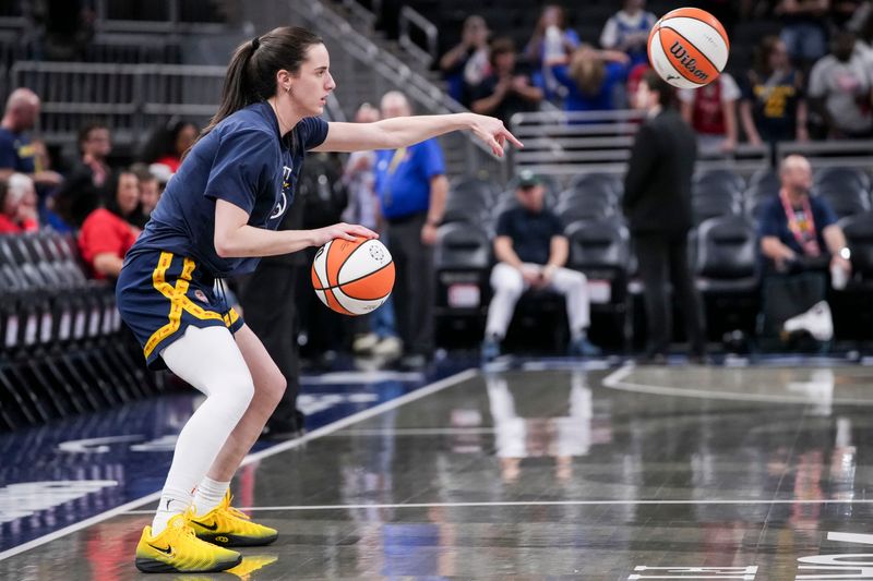 Indiana Fever guard Caitlin Clark (22) warms up Friday, Aug. 14, 2026, before a game at Gainbridge Fieldhouse in Indianapolis.