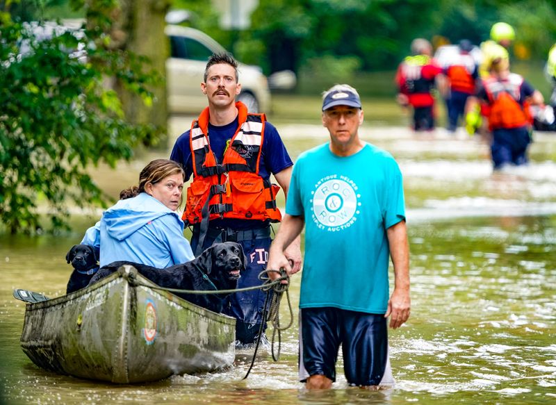 Evacuations are underway in the Ravenswood neighborhood due to flooding after days of heavy rain on Saturday, Aug. 15, 2026, in Indianapolis.