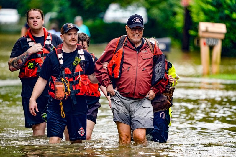 Evacuations are underway in the Ravenswood neighborhood due to flooding after days of heavy rain on Saturday, Aug. 15, 2026, in Indianapolis.
