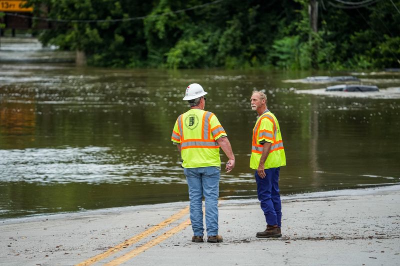 The Indiana Department of Transportation talk Saturday, Aug. 15, 2026, as floodwater remains in downtown Noblesville after days of heavy rain around Indiana.