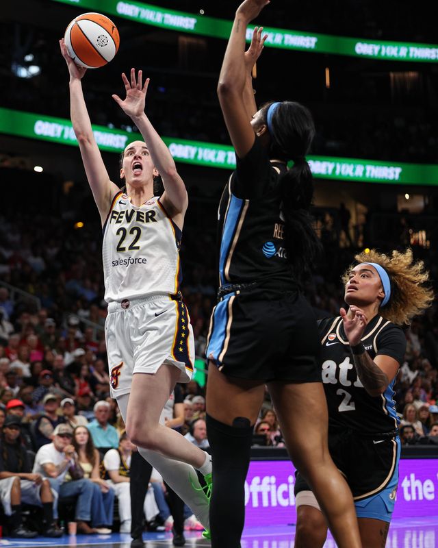 Aug 16, 2026; Atlanta, Georgia, USA; Indiana Fever guard Caitlin Clark (22) shoots against Atlanta Dream forward Angel Reese (5) during the second quarter at State Farm Arena. Mandatory Credit: Colin Hubbard-Imagn Images