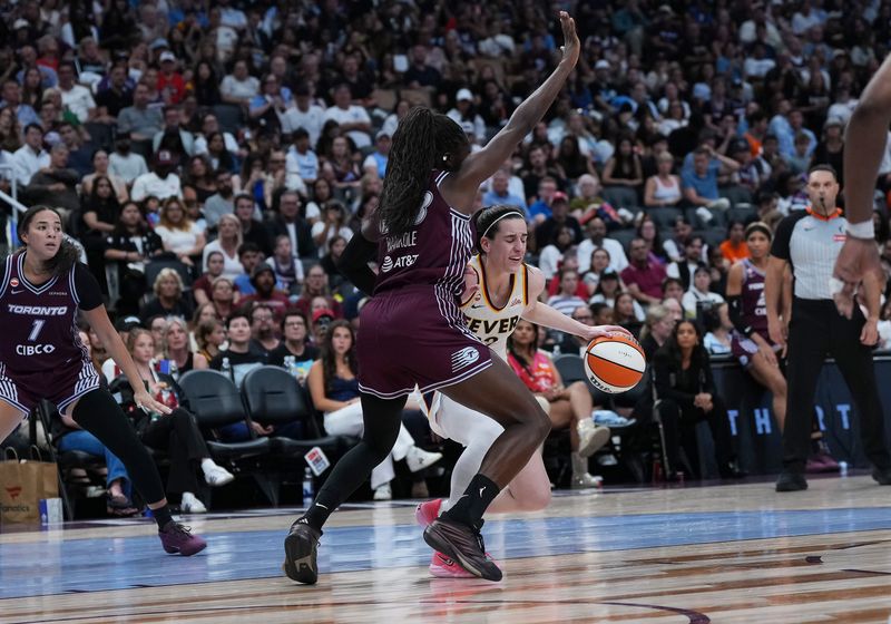 Aug 18, 2026; Toronto, Ontario, CAN; Indiana Fever guard Caitlin Clark (22) controls the ball as Toronto Tempo forward Ornella Bankole (33) tries to defend during the fourth quarter at Scotiabank Arena. Mandatory Credit: Nick Turchiaro-Imagn Images