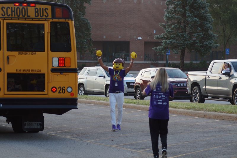 Horizon Elementary School Music Teacher Jon West greets students sitting on a bus on the first day of school at Horizon Elementary School in the Penn-Harris-Madison School Corp. on Wednesday, Aug. 18, 2026.