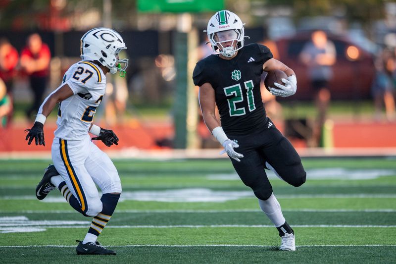 North’s Hunter Mckinney (21) carries the ball as the North Huskies play the Castle Knights at Bundrant Stadium in Evansville, Ind., Friday. August 21, 2026.