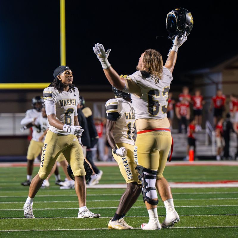 Warren Central High School players celebrate following their 20-14 victory over Center Grove High School in an IHSAA varsity football game on Friday, Aug. 21, 2026, at Center Grove High School.