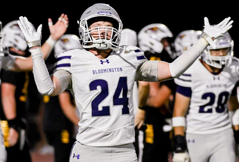 Bloomington South’s Quincy Brahaum (24) celebrates after a fumble recovery during the North-South football game at Bloomington North on Friday, Aug. 21, 2026.