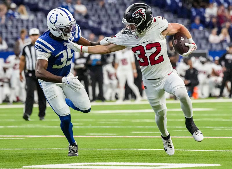 Atlanta Falcons running back Cash Jones (32) rushes up the field against Indianapolis Colts cornerback Johnathan Edwards (35) on Saturday, Aug. 22, 2026, during the preseason game against the Atlanta Falcons at Lucas Oil Stadium in Indianapolis.