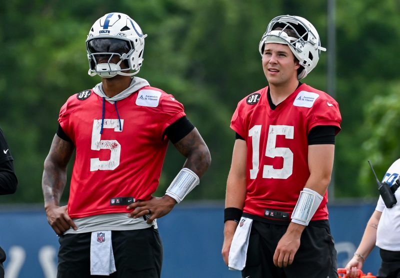 Jun 9, 2026; Indianapolis, IN, USA; Indianapolis Colts quarterback Anthony Richardson Sr. (5) and Indianapolis Colts quarterback Riley Leonard (15) look on during minicamp at Indiana Farm Bureau Football Center. Mandatory Credit: Robert Goddin-Imagn Images