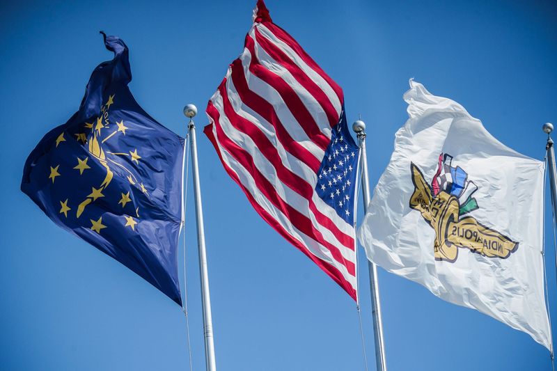 The Indiana state flag, American flag, and Indianapolis Motor Speedway flag all wave Friday, May 20, 2022, during Fast Friday in preparation for the 106th running of the Indianapolis 500 at Indianapolis Motor Speedway.