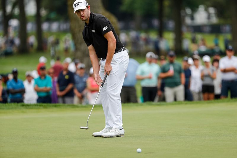 Patrick Cantlay putts on the 5th green during Round 1 of the Rocket Mortgage Classic at the Detroit Golf Club in Detroit on Thurs., July 28, 2022.