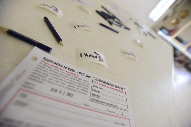 "I voted" stickers and application forms lay on a table for voters at the Marysville Masonic Temple during the Michigan Primary election on Tuesday, August 3, 2022.
