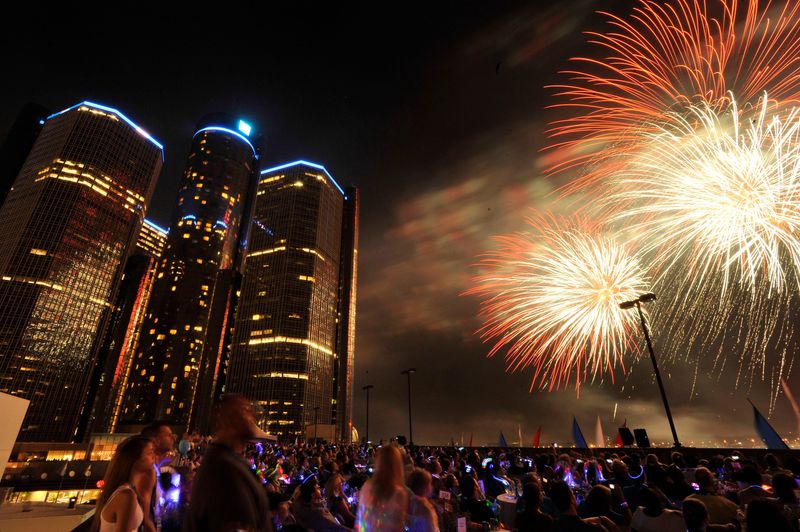Crowds watch the fireworks from the roof of the Miller Parking Garage next to the Renaissance Center in downtown Detroit during the 55th Annual Detroit Fireworks show on Monday, June 24, 2013.