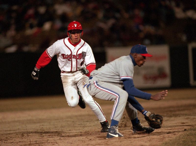 The Lansing Lugnuts' Carlos Beltran rounds the Rockville Cubbies' third baseman en route to scoring a run at Oldsmobile Park during the inaugural game at then-Oldsmobile park on April 6, 1996. Beltran will be inducted into the National Baseball Hall of Fame.