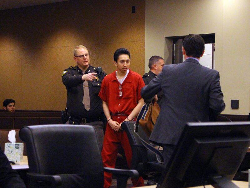 Juan Sandro Cabrera, 19, is led by deputies to his sentencing in Ottawa County on Jan. 6, 2020.