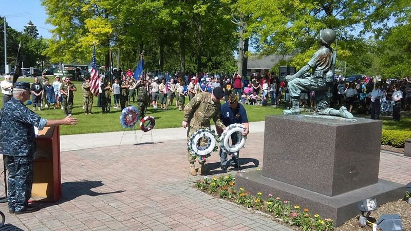 The wreath-laying ceremony at a previous Flat Rock Memorial Day service is shown. This year's parade and service are May 25.