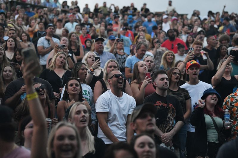 Fans sing along as Post Malone brings his If Y’all Weren’t Here, I’d Be Crying Tour to Pine Knob in Clarkston, Mich. on July 11, 2023.