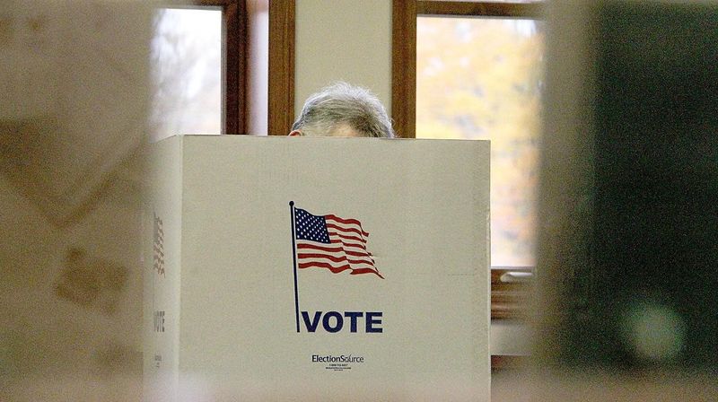 A resident completes their ballot in a previous election.