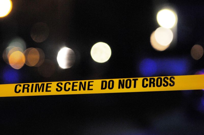 Crime tape lines the streets in Eastpointe, Mich., where a triple-homicide happened. Photos from the scene of a triple homicide in Eastpointe, Mich., on Monday, April 13, 2015. Police have a suspect in custody and the home where a woman and two children were found was being quarantined. (Elizabeth Conley/The Detroit News)