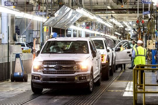 Ford F-150 trucks come off the assembly line at the Ford Rouge Plant in Dearborn on Thursday, Sept. 27, 2018.