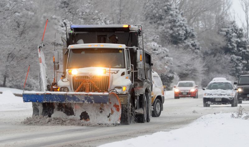 A city snowplow moves snow on Harmony Road on Jan. 31, 2014, after an overnight storm dropped about 6 inches of snow in Fort Collins.