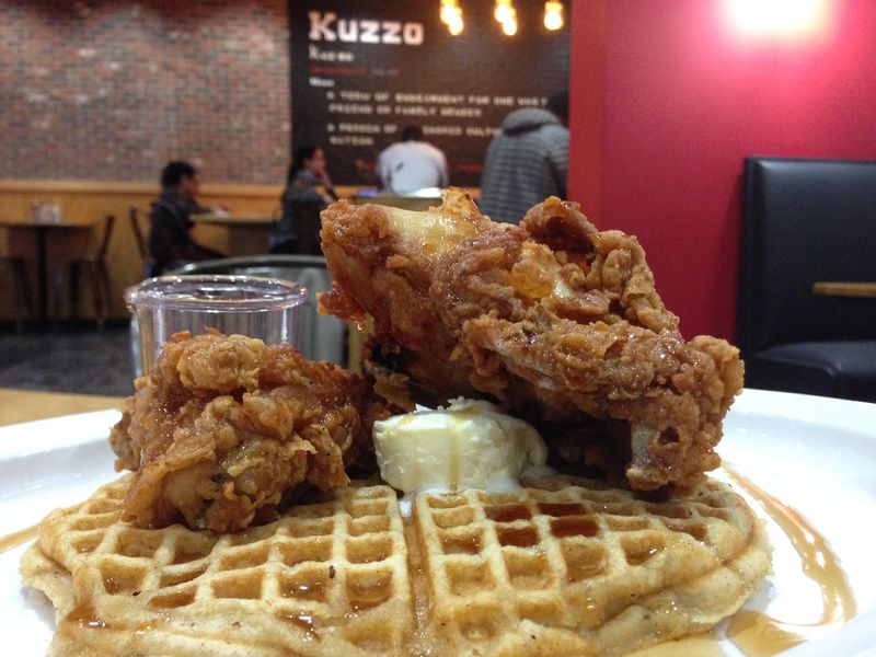 Kuzzo’s offers the What Up Doe, a chicken and waffles dish that includes three pieces of chicken, two waffles, grits, eggs and cheese.