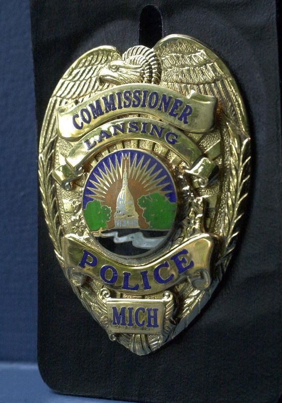 - -Lansing Police Commissioner Badge.