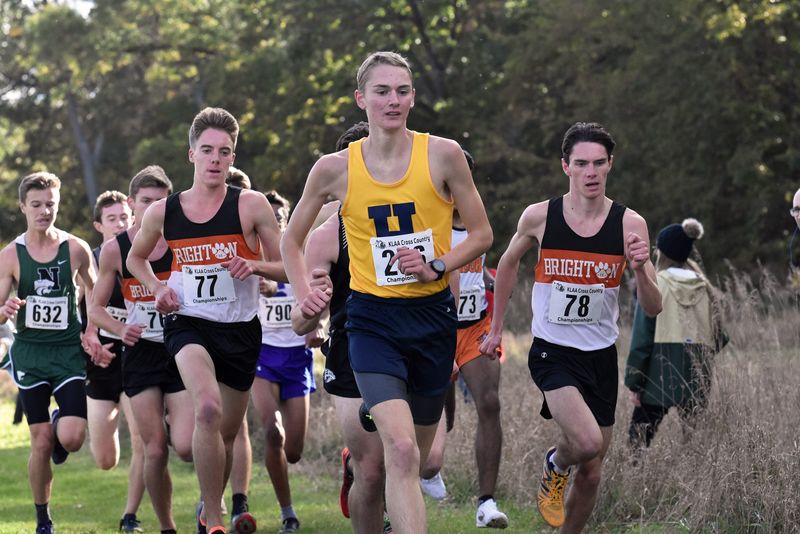 Brighton's Jack Spamer (77) and Zach Stewart (78) and Hartland's Riley Hough (center) are three of the top five boys cross country runners in Livingston County history.