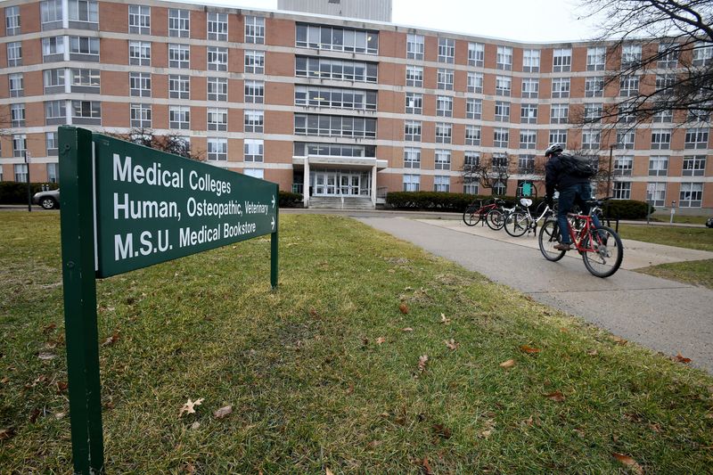 Students enter and leave East Fee Hall, home of the MSU College of Osteopathic Medicine in East Lansing on Friday, Feb 23, 2018.