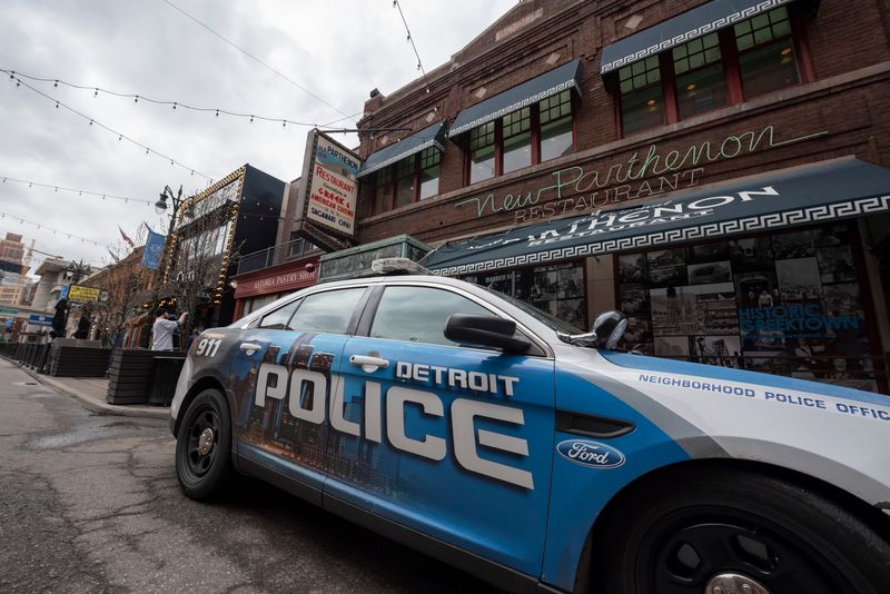 A Detroit police vehicle sits on Monroe Street in Greektown on April 18.