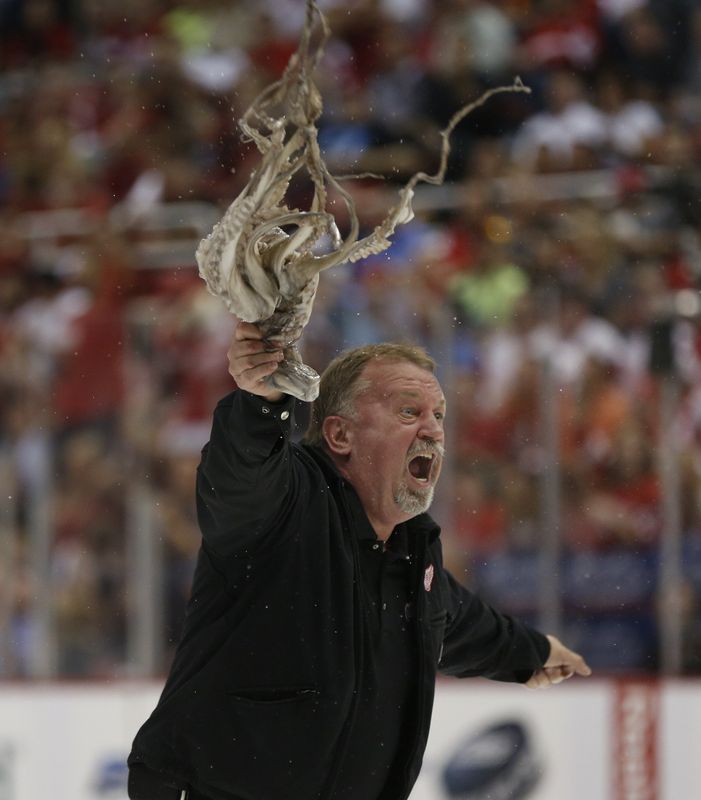 Zamboni driver Al Sobotka swings an octopus after retrieving from the ice in the third period of the Detroit Red Wings 3-1 win over the Chicago Blackhawks in the Stanley Cup Playoffs in Detroit on May 20, 2013.