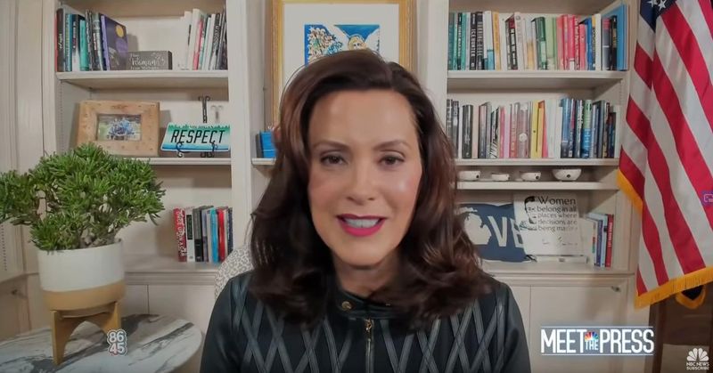 Michigan Gov. Gretchen Whitmer speaks on NBC's Meet the Press Sunday, October 18. A pin with the numbers "8645," a anti-Trump message, can be seen in the background.
