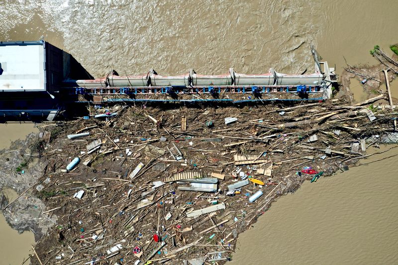 Debris backs up along the Sanford Dam near the Village of Sanford, Michigan. The Edenville dam failed on May 19, 2020, sending the contents of Wixom lake downriver into the Sanford dam, causing it also to fail.