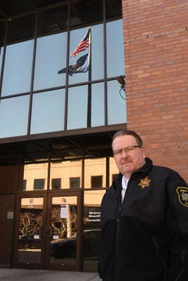 Monroe County Sheriff and former jail administrator Troy Goodnough stands outside the main county jail in downtown Monroe in this photo from April, 2020.