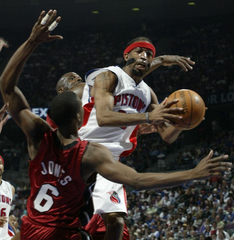 Detroit Pistons' Richard Hamilton goes against the defense of Miami Heat's Eddie Jones during Game 3 of the Eastern Conference finals May 29, 2005 at the Palace of Auburn Hills.