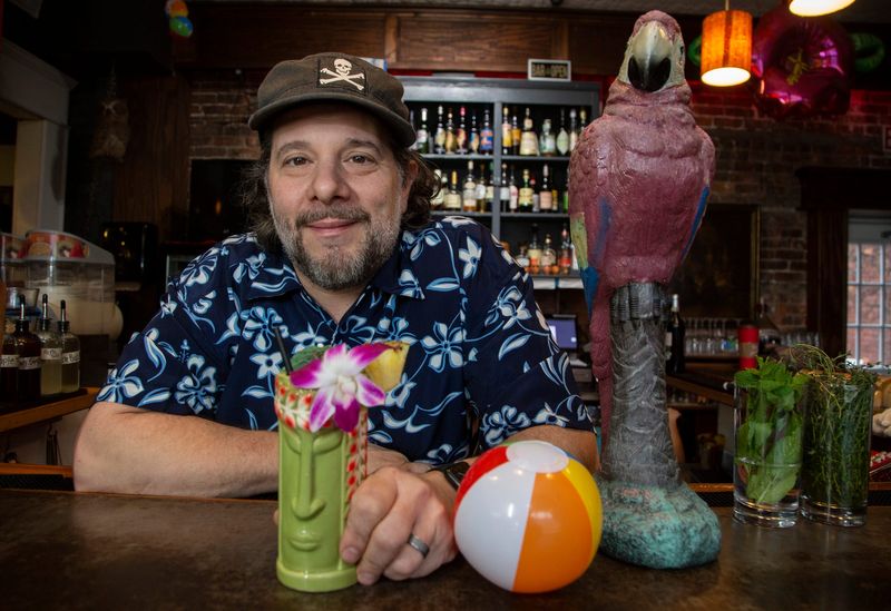Greg Mudge at his restaurant Mudgie's Deli and Wine Shop on Jan. 16, 2020. Mudgie's Deli and Wine Shop in Corktown is not alone with the impact of not having the North American International Auto Show in town this winter. Owner Greg Mudge is running a special summer-themed menu pegging the upcoming boat show to help them get their business through the winter slump.