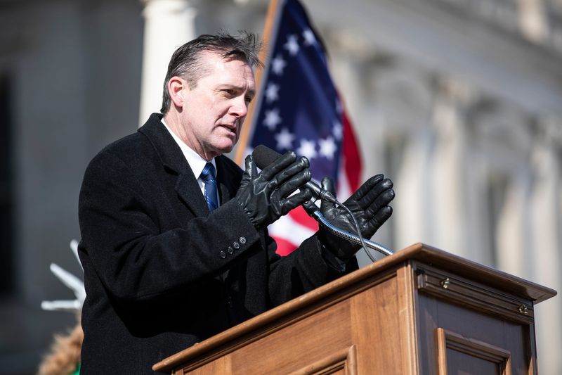 Republican gubernatorial candidate Ralph Rebandt speaks during a protest outside of the Michigan State Capitol in Lansing demanding a forensic audit on Feb. 8, 2022.