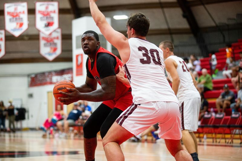 Holland alumni and event organizer Coreontae DeBerry looks to score Saturday, July 28, 2023, at Holland High School.