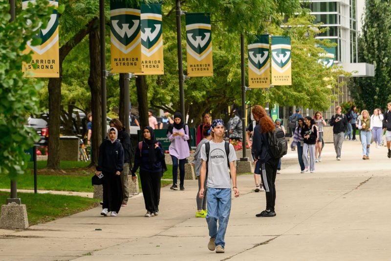 Students and faculty walk down Gullen Mall on the campus of Wayne State University, in Detroit, August 30, 2023.
