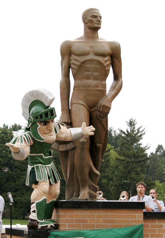 MSU's mascot, Sparty helps unveil the new Sparty statue on the campus of Michigan State University, Aug. 25, 2005. Members of the MSU Marching Band play the fight song during the unveiling.