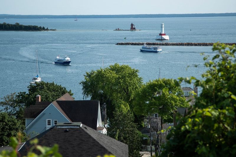 Ferry boats leave and arrive at Mackinac Island on July 21, 2021.