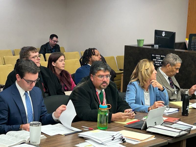 Shawn and Jamie Wilmoth and Willie Reed (right), sitting next to each other behind a row of attorneys, appear for their preliminary exams Jan. 10, 2024 in 37th District Court in Warren. Jamie Wilmoth was acquitted.