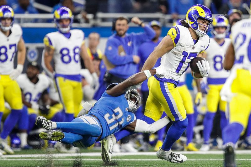 Detroit Lions safety Kerby Joseph (31) tackles L.A. Rams wide receiver Puka Nacua (17) during the second half of the NFL wild-card playoff game at Ford Field in Detroit on Sunday, Jan, 14, 2024.